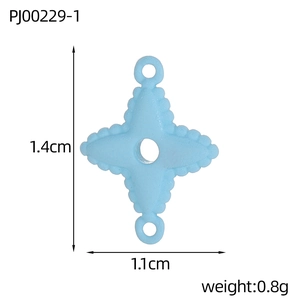 Macro detail of 1.4cm light blue star charm with dual loops for DIY jewelry making