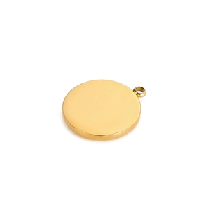 Close-up of polished gold circular pendant with a mirror finish for DIY jewelry