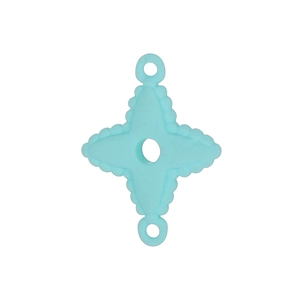 Macro detail of a light blue star-shaped silicone charm with tactile texture and two loops