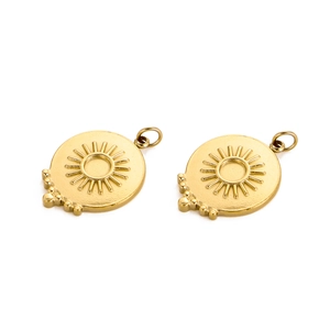 Detail of golden stainless steel sun charm with embossed rays for DIY jewelry making