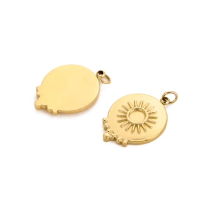 Detailed view of round gold sunburst pendants with embossed sun patterns and polished finish