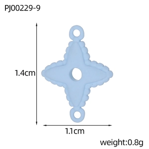 Macro view of light blue four-pointed star pendant with measurements 1.4cm x 1.1cm