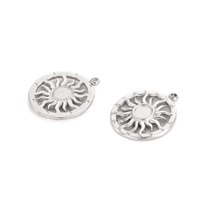 Macro view of silver sun pendants with radial light design and hollow structure