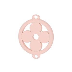 Detailed macro view of a pink enamel four-leaf clover charm for DIY jewelry making