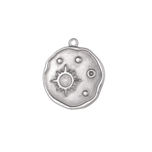 Detailed close-up of a vintage sun and moon embossed pendant with antique silver finish