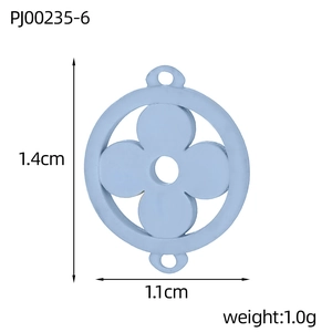 Detailed view of light blue clover pendant with dimensions 1.4cm height and 1.1cm width