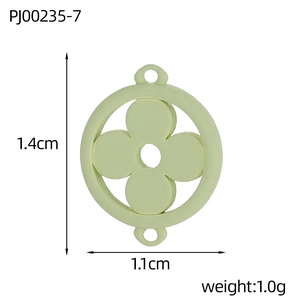 Macro view of light green enamel four-leaf clover charm with 1.4cm dimensions for DIY jewelry
