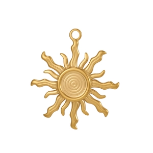 Detailed view of a gold sun pendant with relief texture and smooth hanging ring