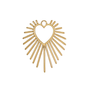 Macro view of gold heart pendant with hollow center and sunburst radiating lines design