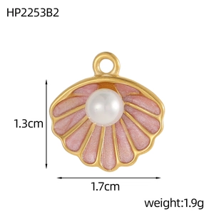 Detail of shell heart pendant with pink enamel and pearl inlay in 1.7cm size