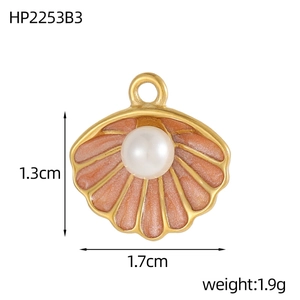 Detail of heart shell pendant with pearl and pink enamel, sizing 1.7cm by 1.3cm