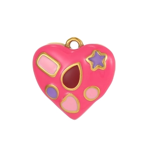 Detail of pink heart pendant with colorful star and droplet enamel patterns and gold ring