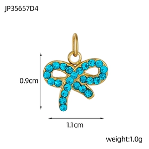 Golden bow pendant with blue rhinestones showing dimensions 0.9cm height and 1.1cm width