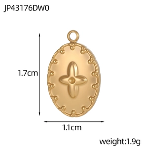 Detailed view of vintage gold oval pendant showing dimensions 1.7cm by 1.1cm