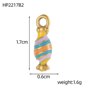 Macro detail of rainbow enamel candy charm with gold plating for jewelry making