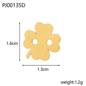 Detailed macro view of golden clover stainless steel DIY accessory with dual holes