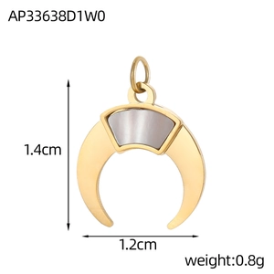 Detailed view of a crescent moon pendant with white shell inlay and gold plating
