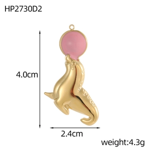 Detailed view of seal holding ball pendant in gold finish and pink enamel detail