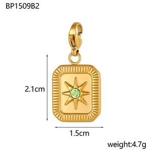 Detail showing vintage golden star pendant with green zircon and 2.1x1.5cm dimensions
