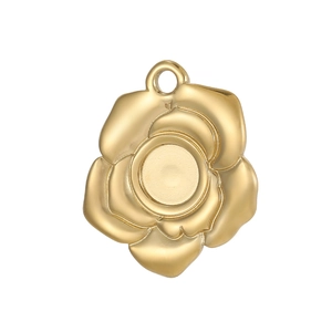 Macro view of gold rose flower jewelry pendant base with a round flat bezel setting