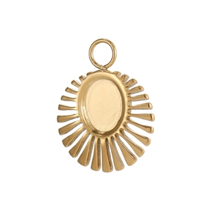 Detail of a golden sunburst metal pendant with an oval plate for jewelry making