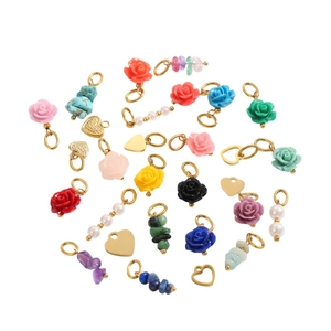 DIY Jewelry Kit with Resin Roses, Golden Heart Pendants, and Pearl Charms on White Background