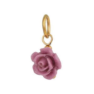 Macro shot of a purple resin rose flower pendant with a golden metal ring attachment