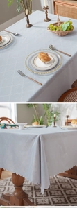 Detail of light blue quatrefoil tablecloth with elegant scalloped edges and textured fabric