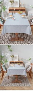 Close-up of light blue tablecloth with geometric jacquard and wavy scalloped edges