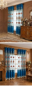Detail of luxury blue embroidered curtains with intricate gold patterns and lace tassels