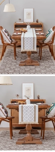 Beige woven table runner with geometric patterns and tassels on a wooden dining table