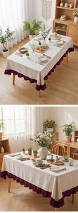 Close-up of beige linen tablecloth with purple ruffled hem detail for dining decor