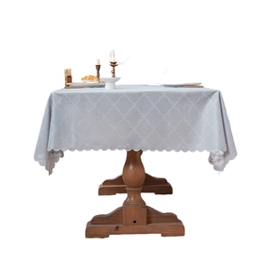 Minimalist light blue tablecloth with white geometric pattern and scalloped wavy edges