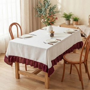 Minimalist cream linen tablecloth with deep red ruffle borders for dining tables