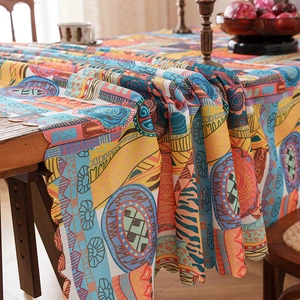 Ethnic bohemian style tablecloth with colorful geometric patterns on a wooden table