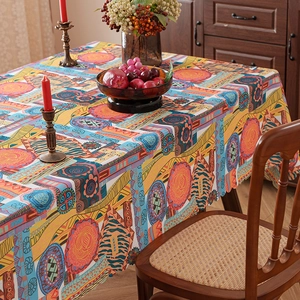 Ethnic bohemian geometric tablecloth in vibrant orange and blue for dining room decor
