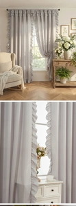 Detail of light grey thickened phantom yarn curtain with ruffled edges in French retro style
