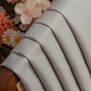 Thick grey herringbone pattern blackout curtains with a satin finish for living rooms