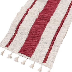 Striped red and beige Christmas table runner with boho tassels and woven texture
