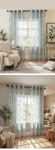 Detail of light blue lace curtains with white floral embroidery and metal grommets