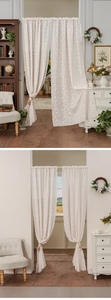 Detailed close-up of French floral lace door curtain with scalloped edges and tassels