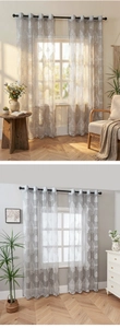 Detail of grey damask sheer curtains with elegant white patterns and silver grommets