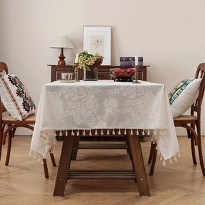 Elegant beige rectangle tablecloth with vintage floral jacquard and decorative tassels