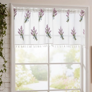 Detailed lace cafe curtain featuring lavender embroidery and white pom-pom fringe trim