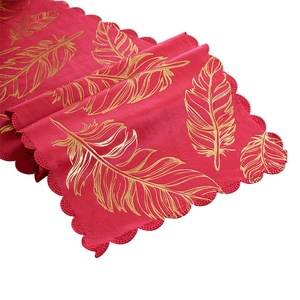Luxurious red velvet table runner with gold feather bronzing and scalloped edges