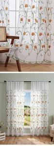 Close-up of orange tulip embroidery and green wavy edge on white sheer curtain