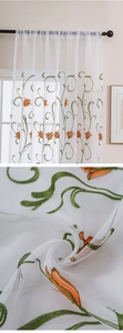Close-up of orange tulip embroidery on white sheer curtain with rod pocket detail