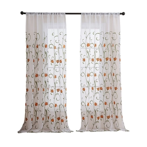 White semi-transparent tulle curtain with orange tulip floral embroidery and green stems