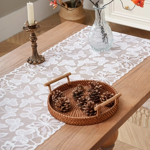 White lace table runner with butterfly hollow patterns and decorative tassels for dining tables