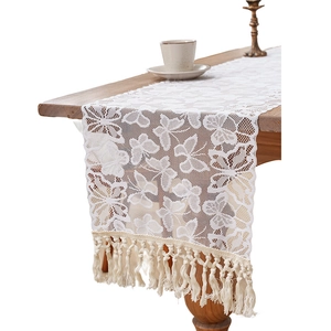 French lace table runner with hollow butterfly patterns and elegant fringe tassels